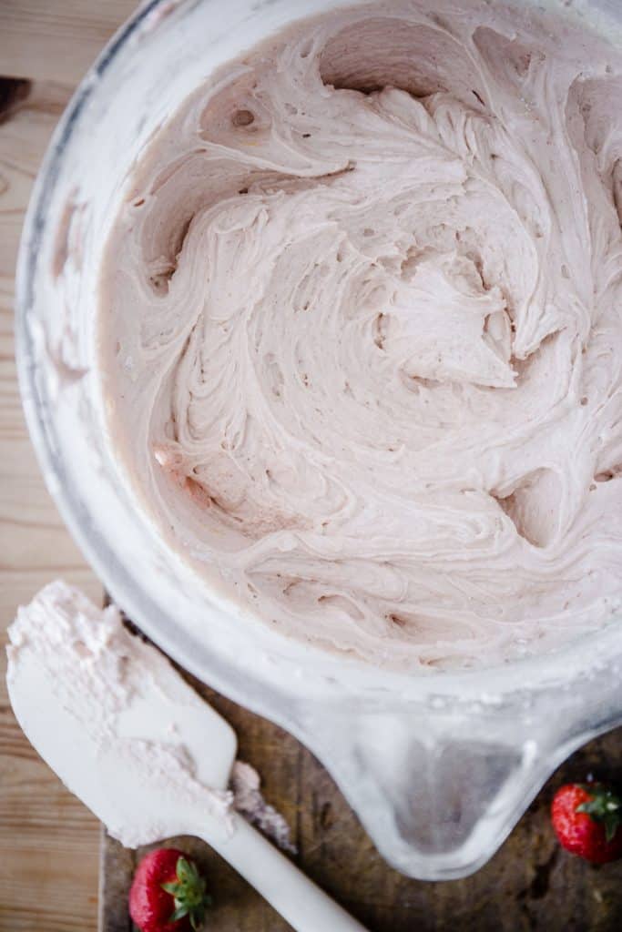 close up of strawberry cake batter in mixing bowl