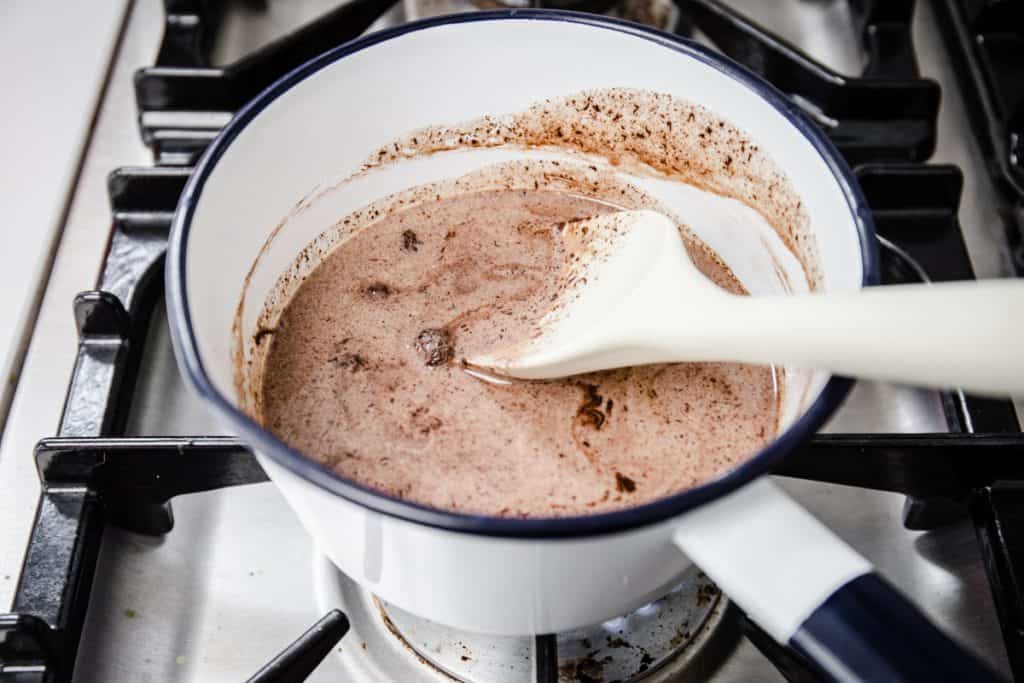 chocolate sauce cooking in a saucepan