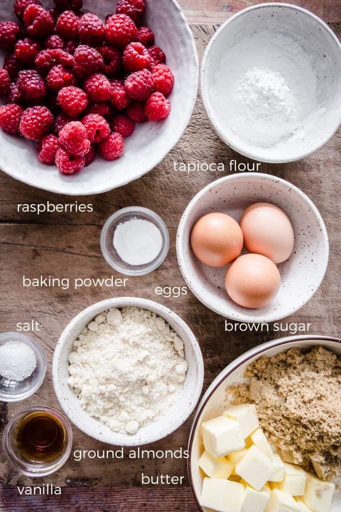 ingredients for raspberry pudding on a wooden board