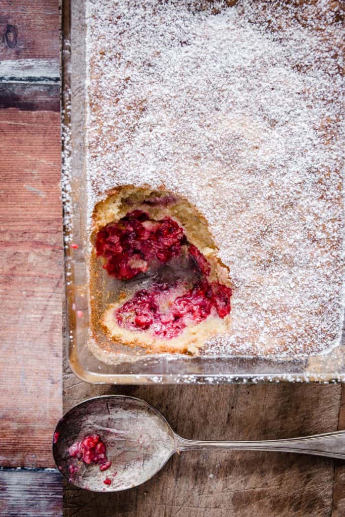 dish of raspberry pudding with a spoon taken out