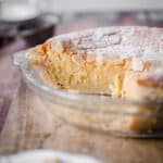 Gluten-Free Frangipane Tart sliced and sitting on wooden board