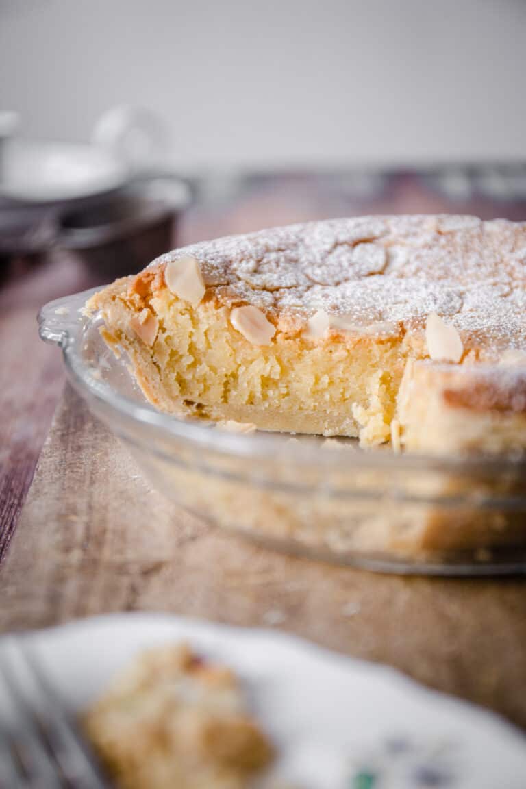 Gluten-Free Frangipane Tart sliced and sitting on wooden board