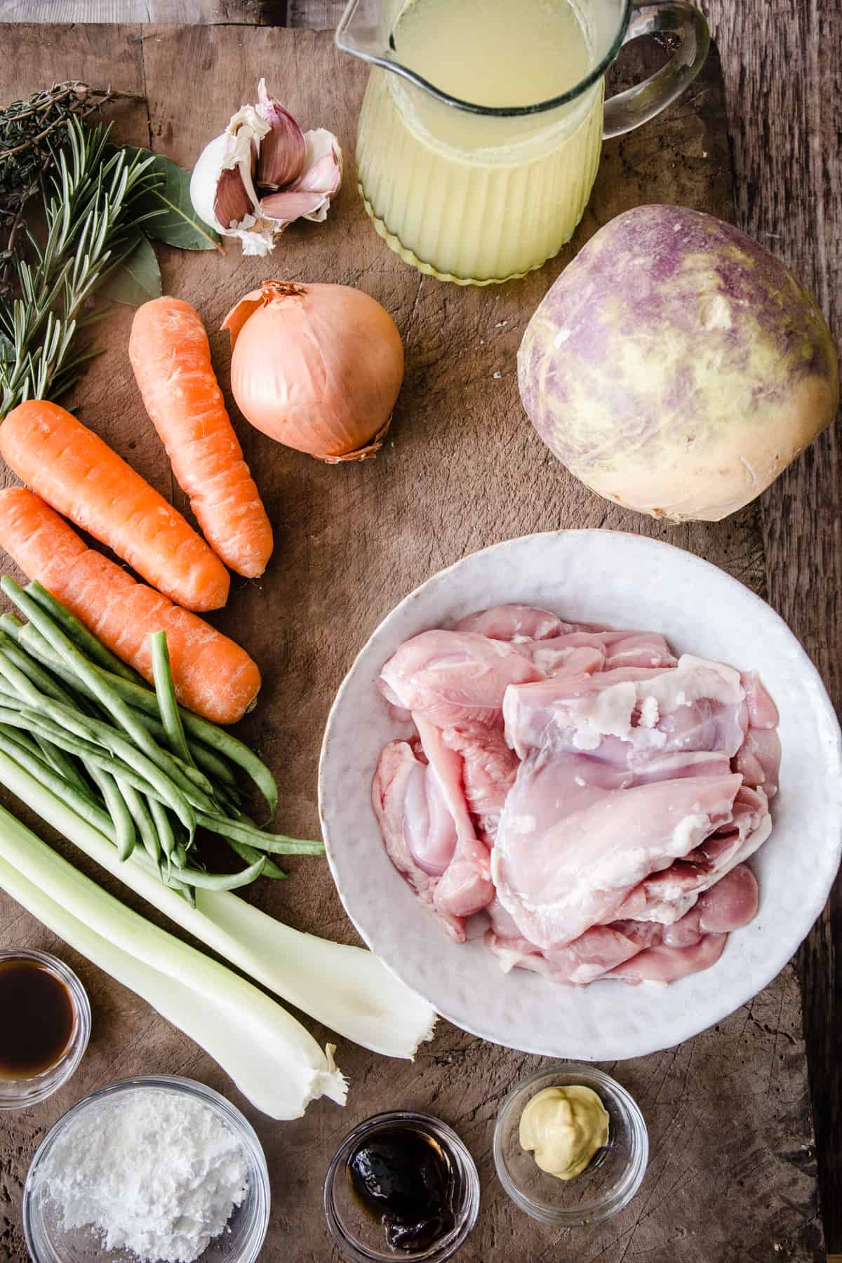 Ingredients for chicken casserole on a wooden board