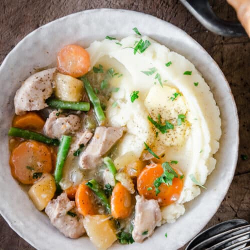 Chicken Casserole in a bowl with mashed potato