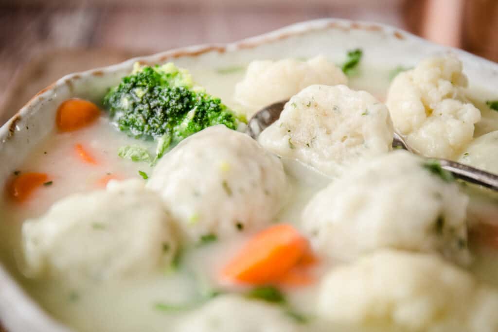 close-up of fluffy dumplings in a stew