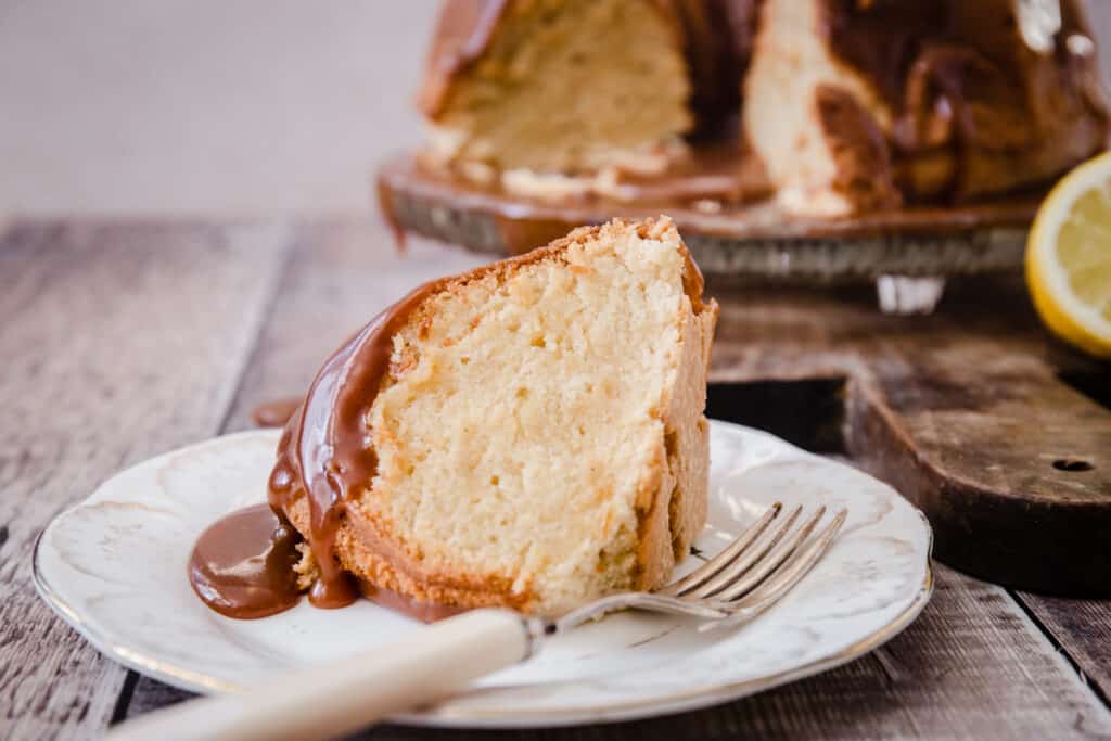 A slice of lemon caramel cake on a plate