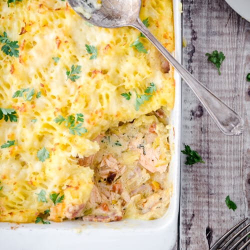 salmon pie with portion scooped out.