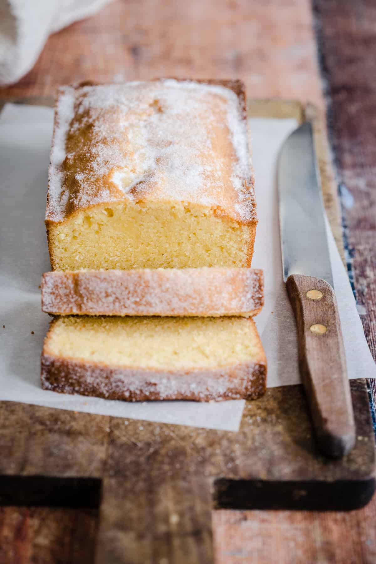 Sliced Rice Flour Madeira Cake next to knife