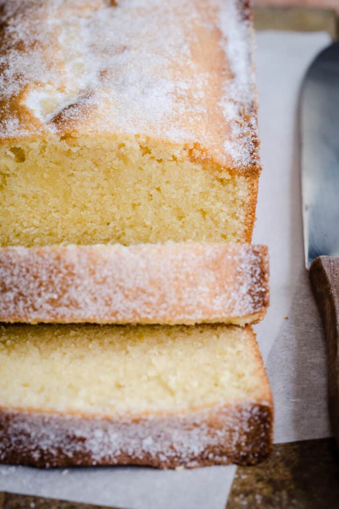 Sliced Rice Flour Madeira Cake next to knife