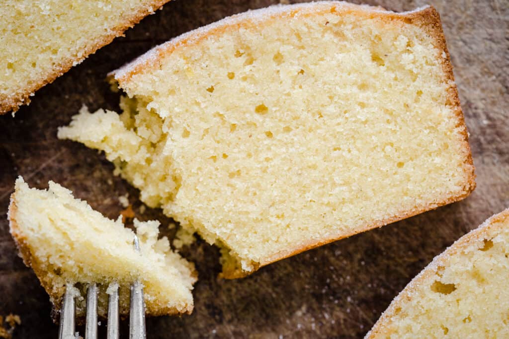 close up of a slice of Rice Flour Madeira Cake with bite taken out