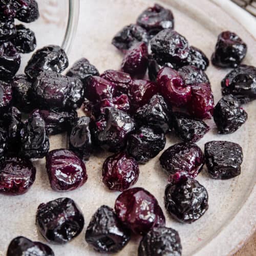 cherries spilling from jar
