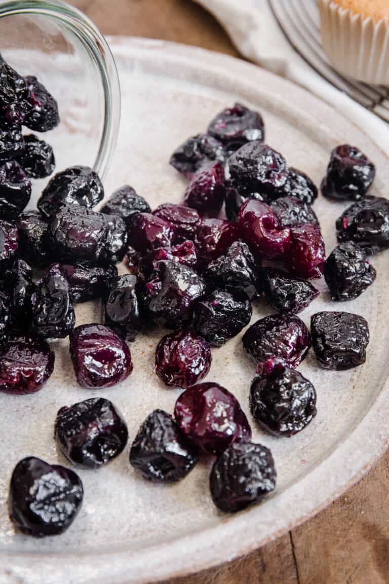 cherries spilling from jar