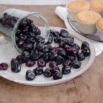 cherries spilling from jar