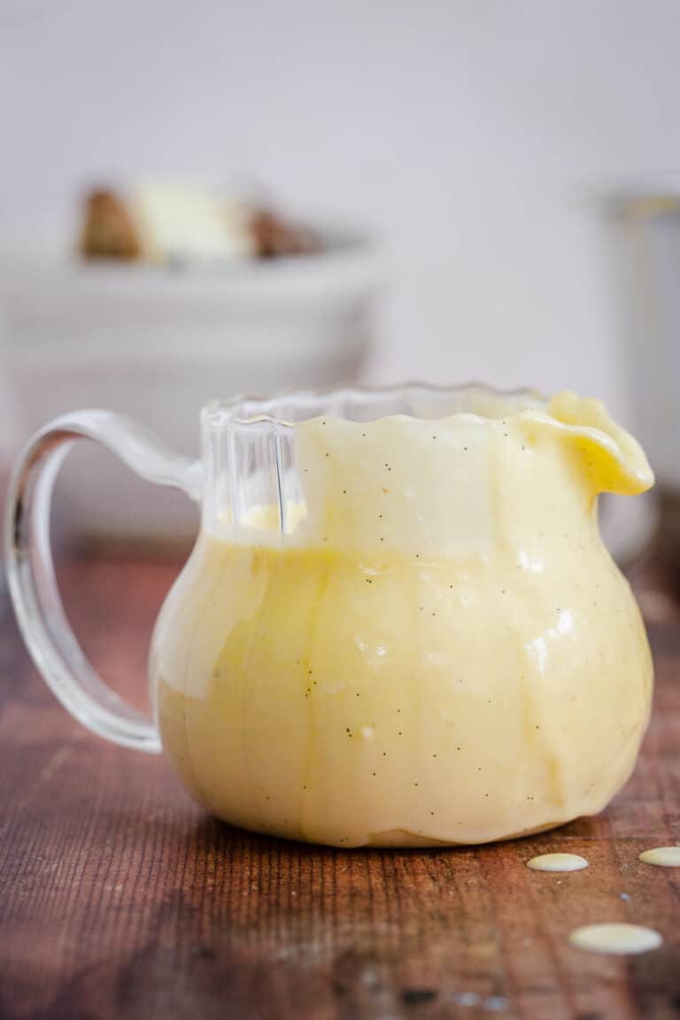 custard in jug on table