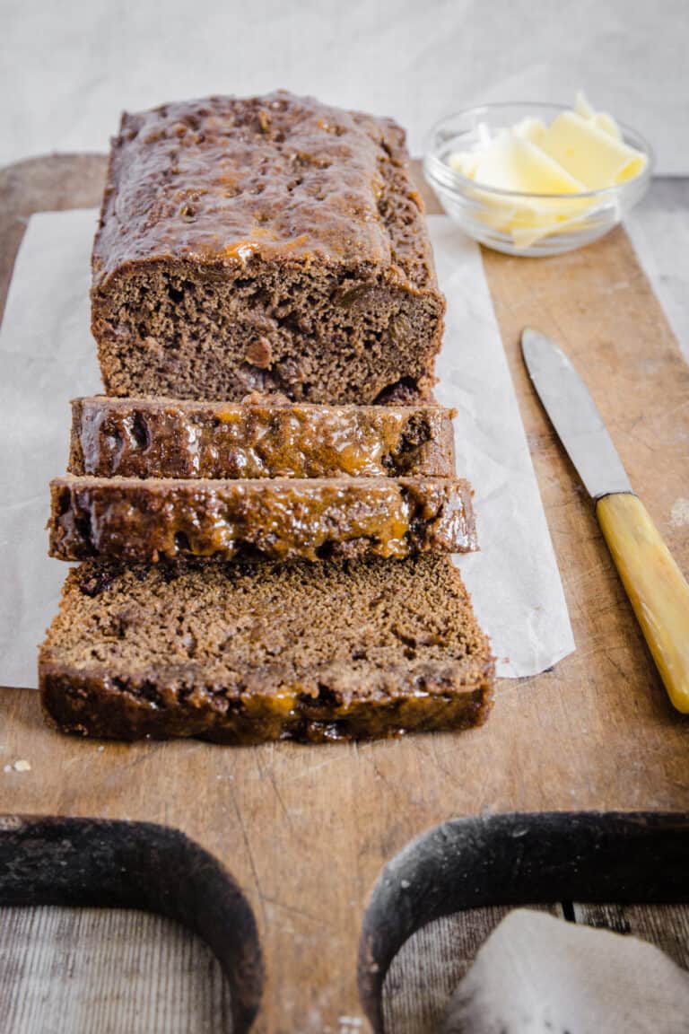 GF Malt Loaf sliced on a wooden board.