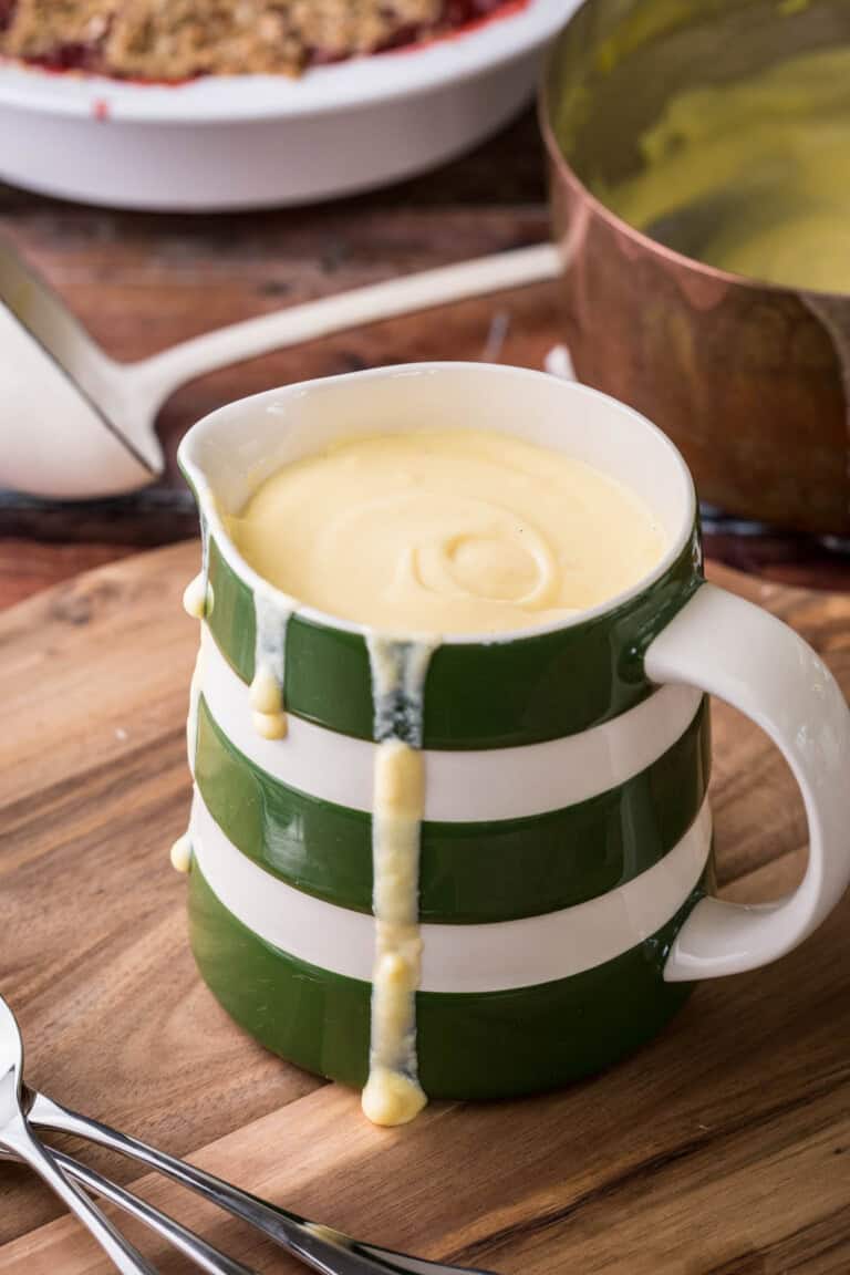 custard in jug on table
