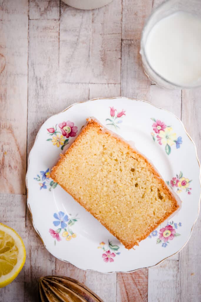 slice of lemon drizzle cake on a plate