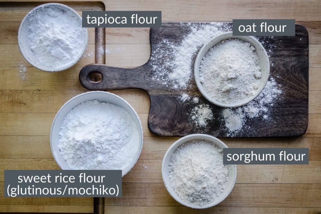 flours in bowls on a wooden board