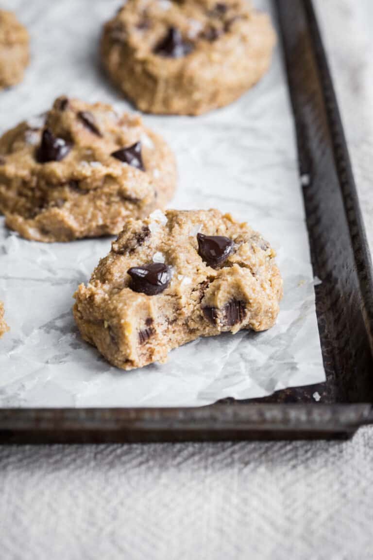 cookie dough bites on a baking tray with bite taken out