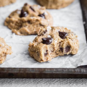 cookie dough bites on a baking tray with bite taken out