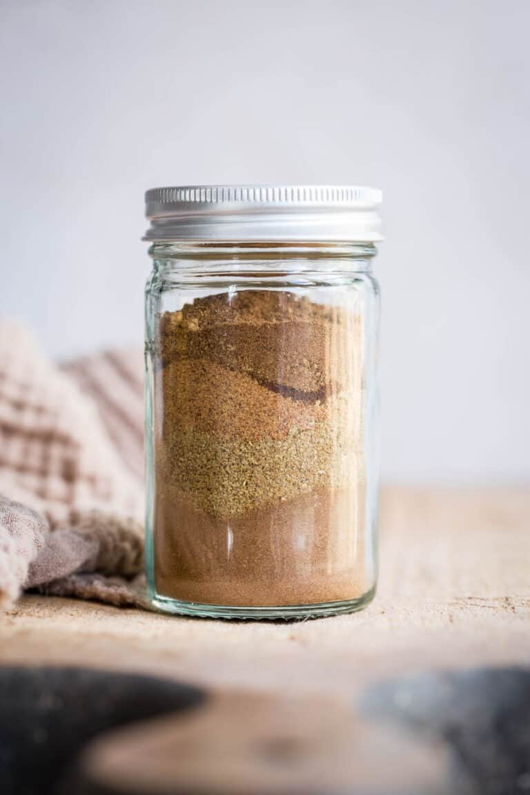 Spices in a jar on a wooden board