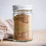 Spices in a jar on a wooden board