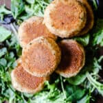 Salmon fishcakes on a bed of leaves