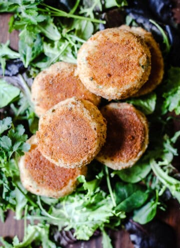 Salmon fishcakes on a bed of leaves