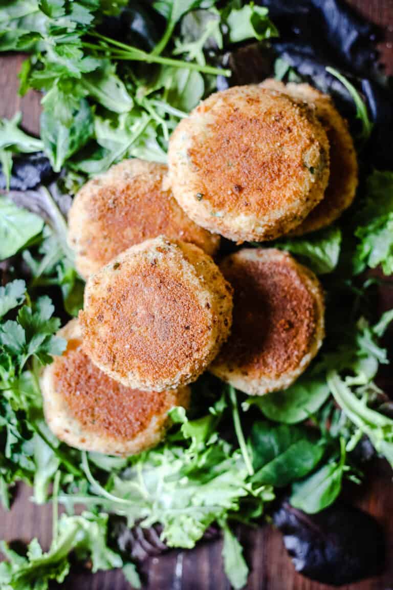 Salmon fishcakes on a bed of leaves