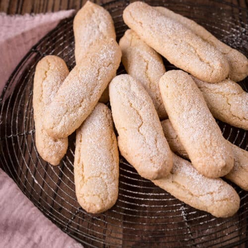 Ladyfingers on a wire rack.