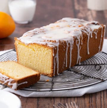 Orange Drizzle Cake cut on a wire rack.