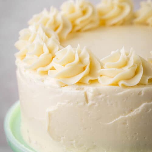 Layer Cake covered in swiss meringue buttercream with piped decoration.