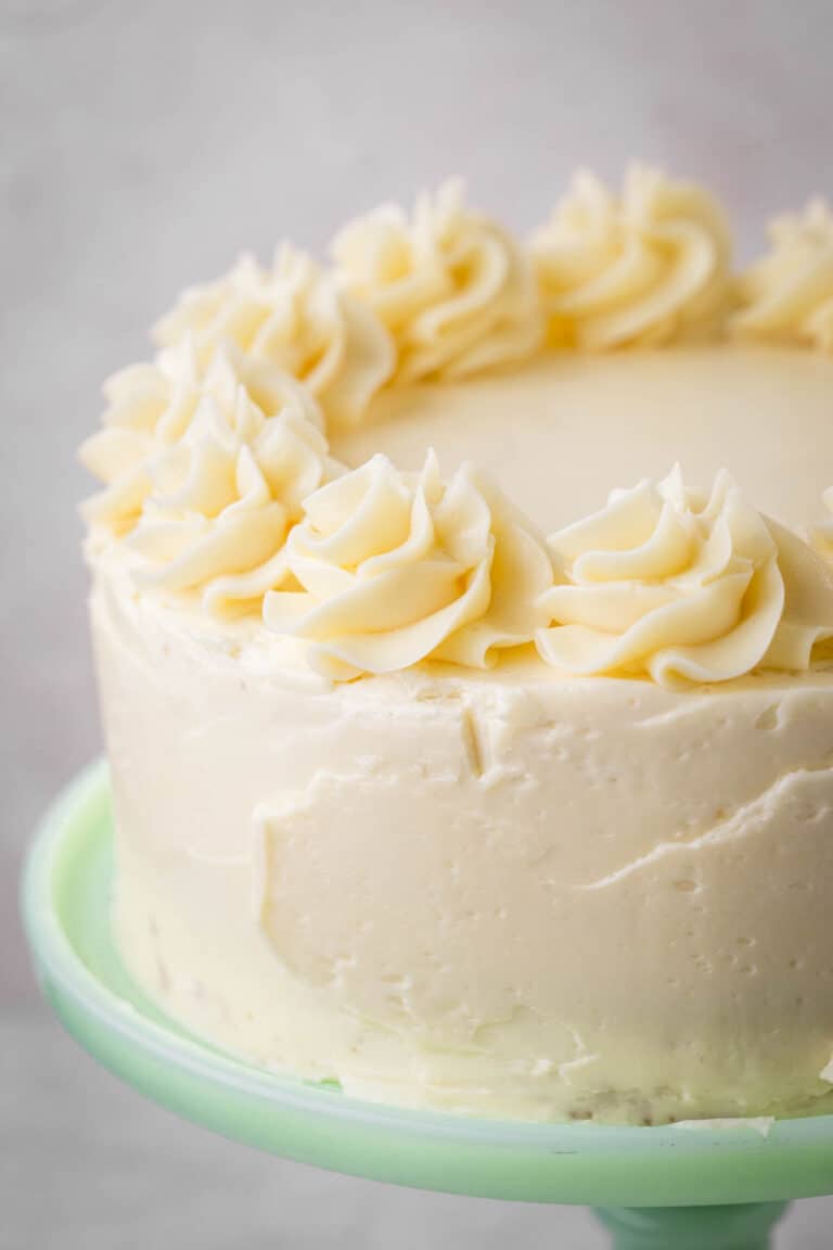 Layer Cake covered in swiss meringue buttercream with piped decoration.