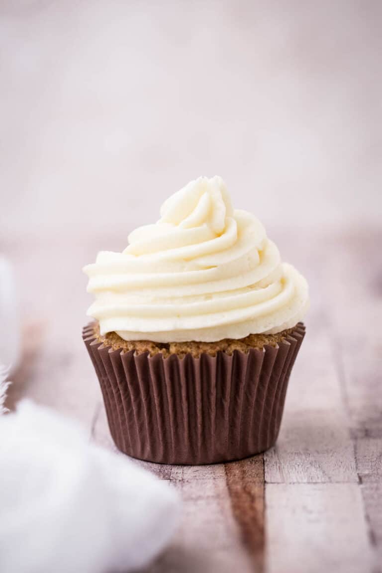 cupcake decorated with a cream cheese buttercream swirl.