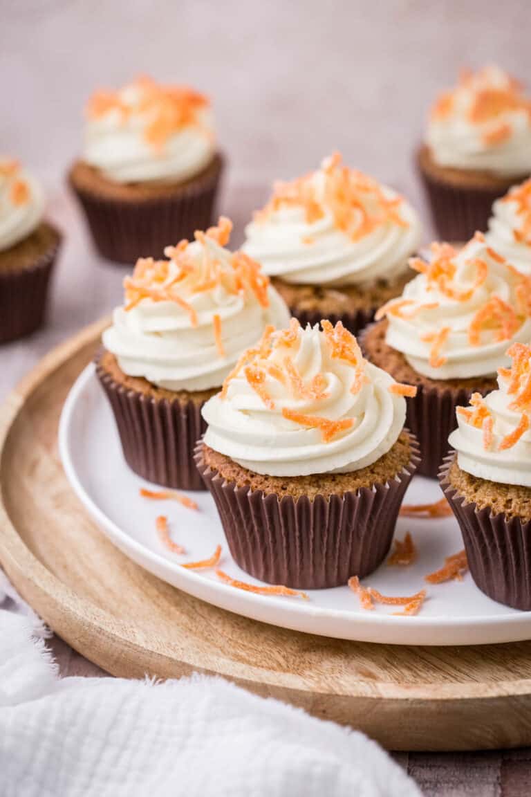Decorated Carrot Cake Cupcakes on a plate.