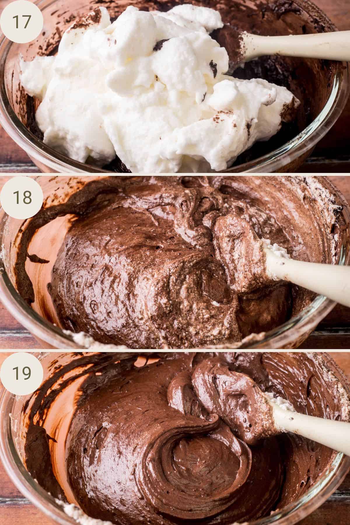 Egg whites folding into chocolate cake batter until smooth.
