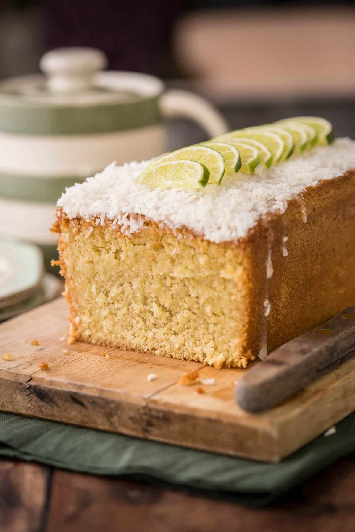 Sliced Gluten-Free Lime and Coconut Loaf Cake showing soft and tender texture.