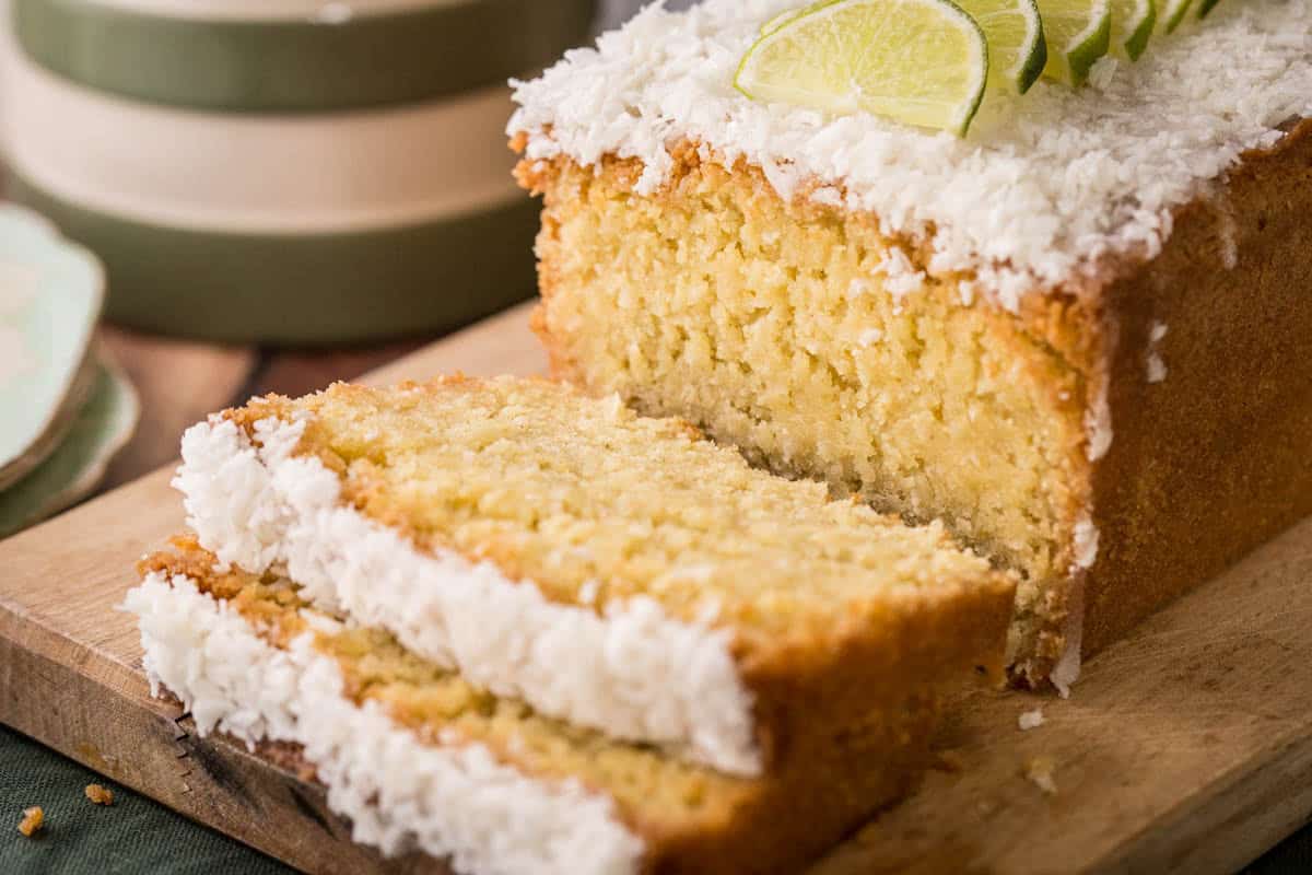 Sliced Gluten-Free Lime and Coconut Loaf Cake showing soft and tender texture.