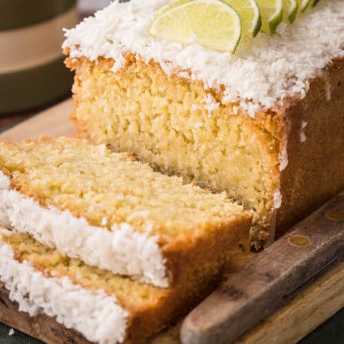 Sliced Gluten-Free Lime and Coconut Loaf Cake showing soft and tender texture.