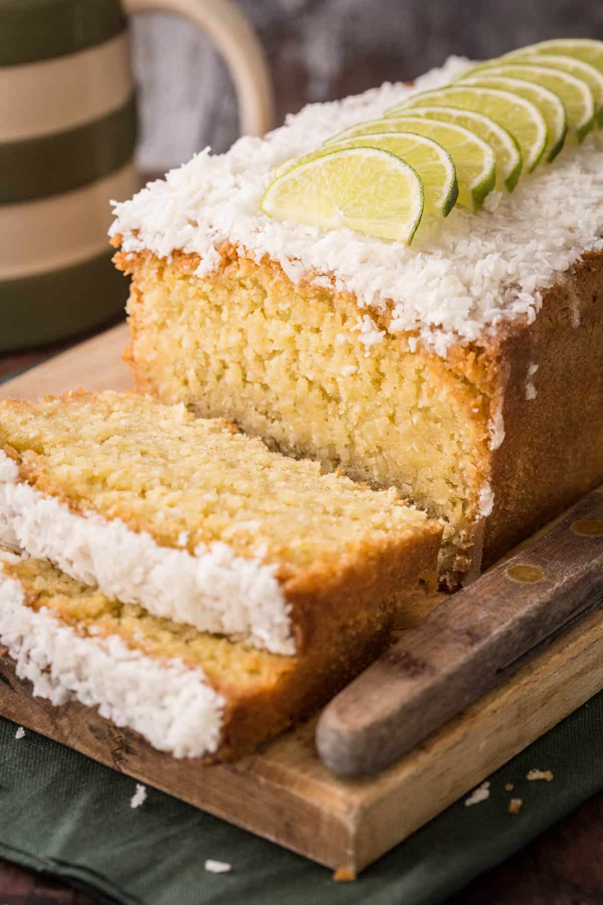 Sliced Gluten-Free Lime and Coconut Loaf Cake showing soft and tender texture.