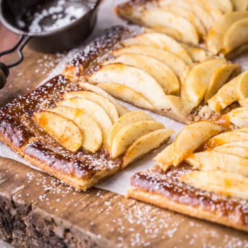 Gluten-Free Apple Tart cut into 8 slices and dusted with icing sugar.