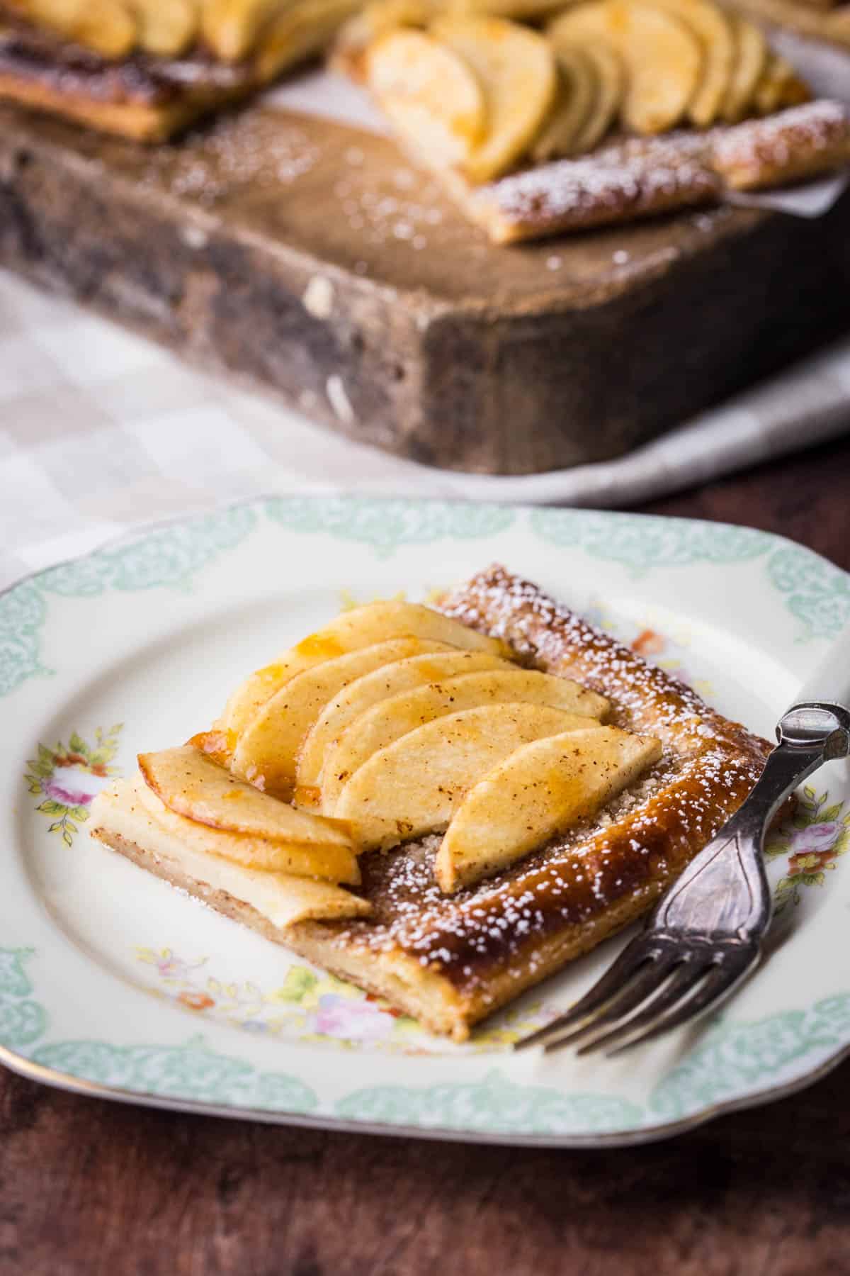 Slice of Gluten-Free Apple Tart on a plate with a fork.
