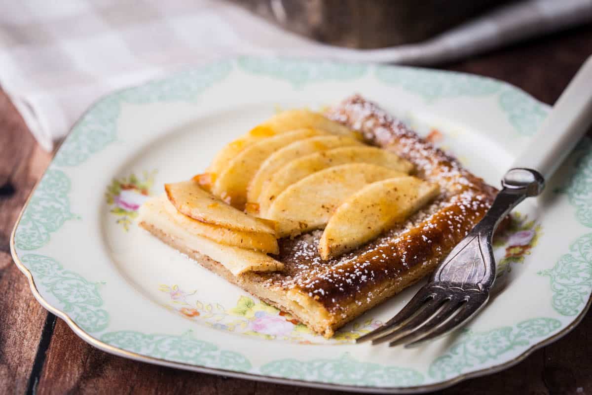 Slice of Gluten-Free Apple Tart on a plate with a fork.