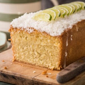 Sliced Gluten-Free Lime and Coconut Cake showing tender fluffy texture.