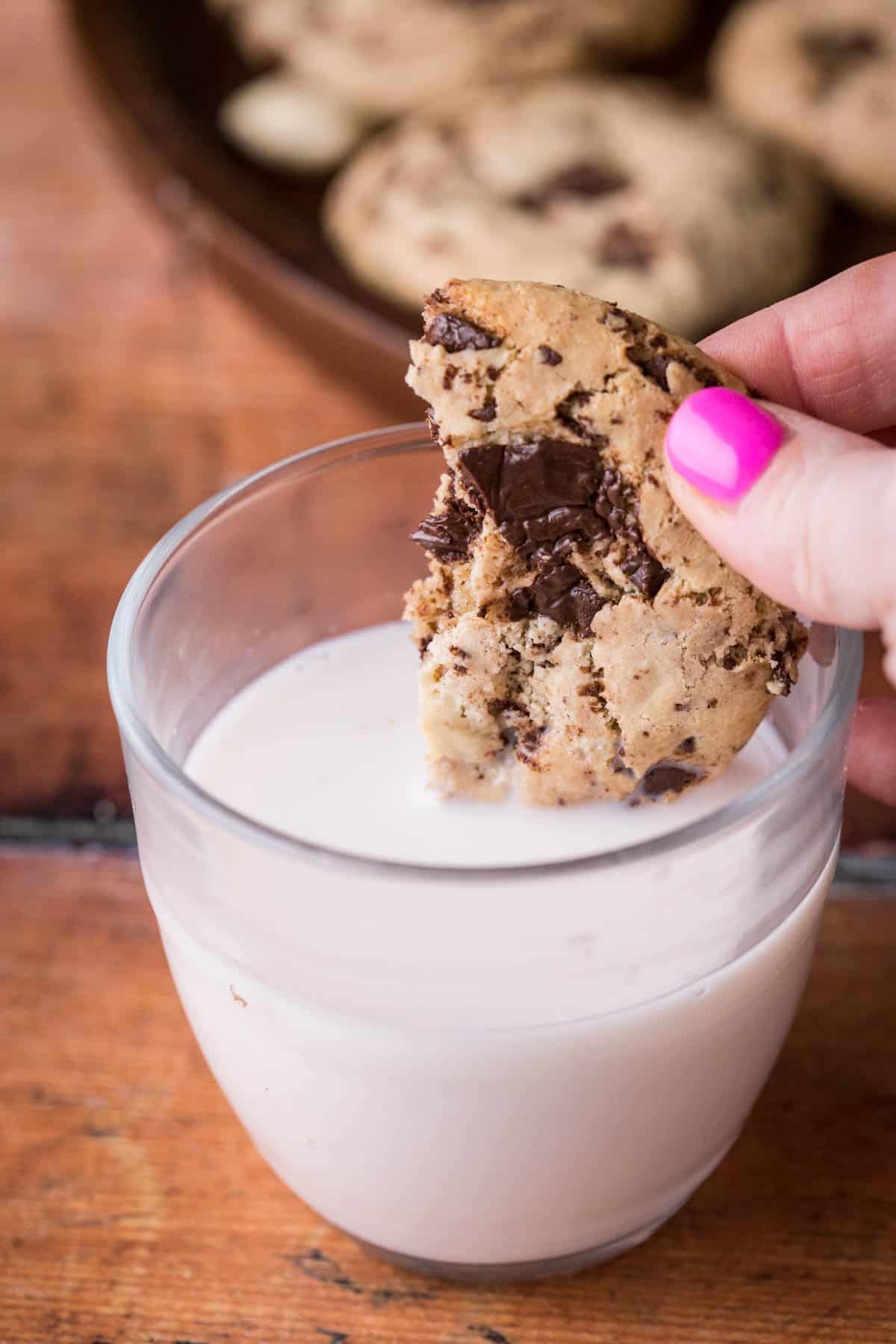 Cashew Butter Cookie dipped into glass of milk.