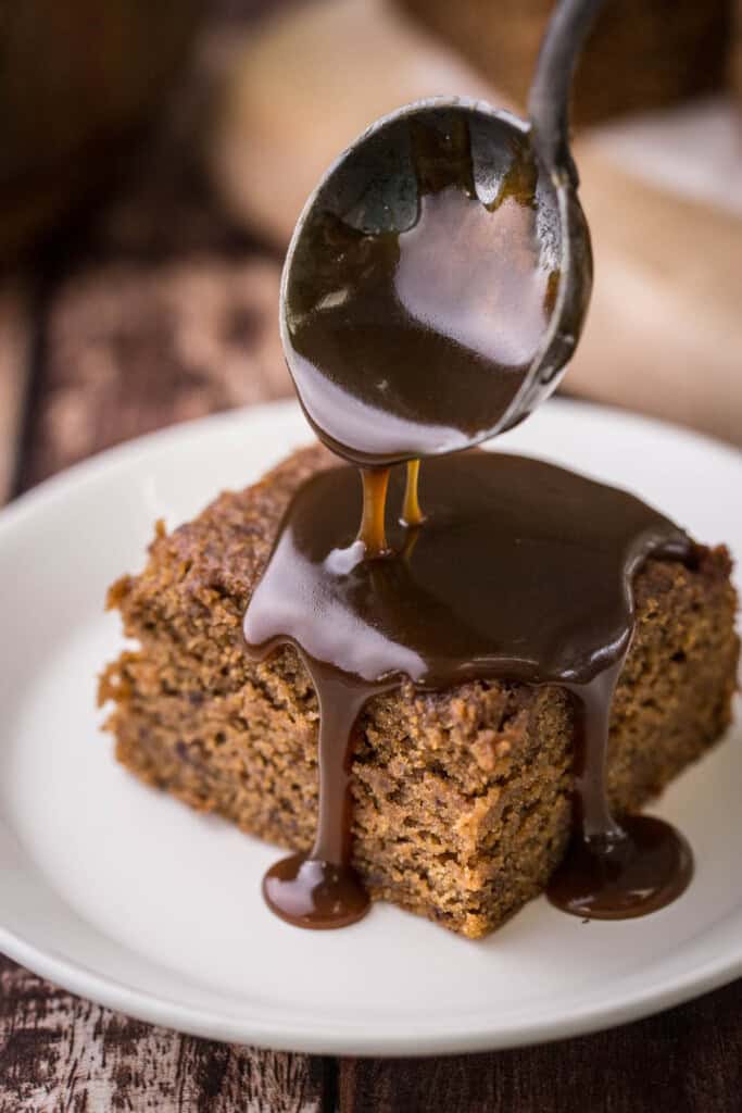 Sticky Toffee Sauce poured over Sticky Toffee Pudding.