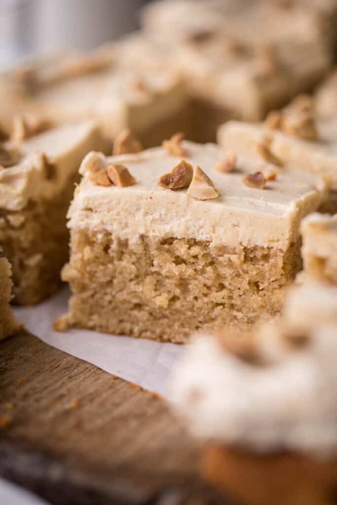 Sliced Gluten-Free Peanut Butter Cake showing soft and fluffy sponge and creamy buttercream.