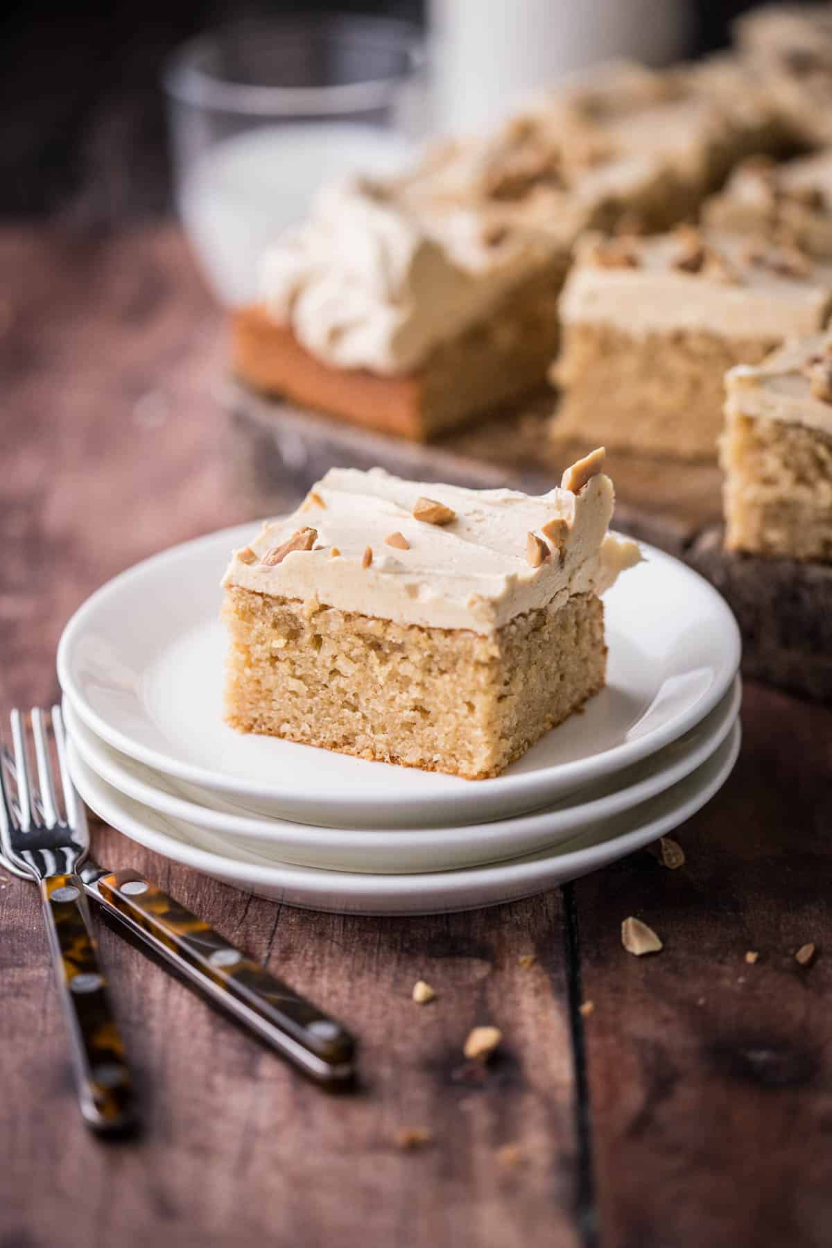 Slice of Gluten-Free Peanut Butter Cake showing soft and fluffy sponge.
