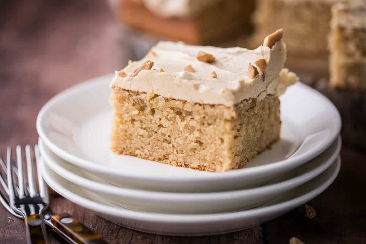 Slice of Gluten-Free Peanut Butter Cake showing soft and fluffy sponge.