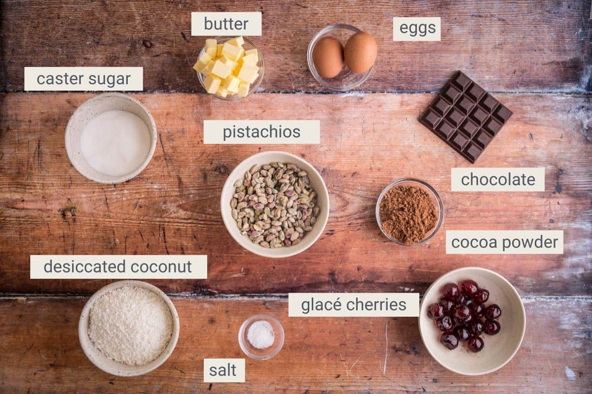 ingredients for Flourless Chocolate Pistachio Coconut Slice on table.